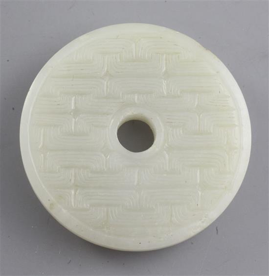 A Chinese pale celadon bi disc, 19th century, diameter 5.1cm